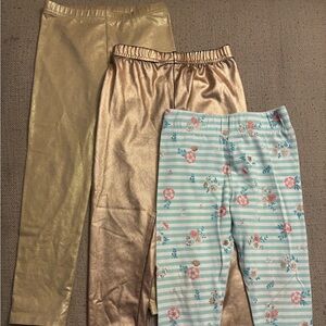2 Pairs of Gold Leggings and 1 Pair of Floral Striped Leggings
